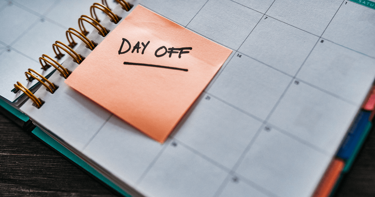 work calendar with a post it that reads 