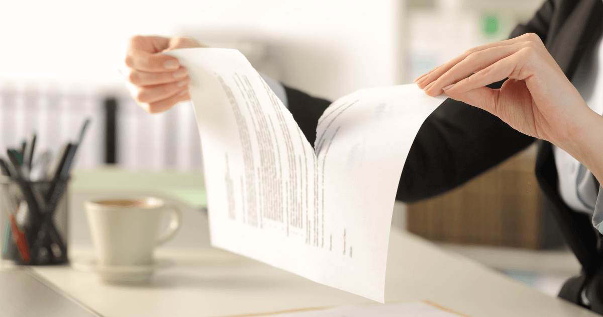 woman tearing a contract apart