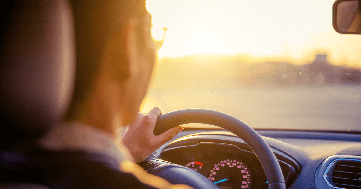 Driver behind the wheel on a sunny day