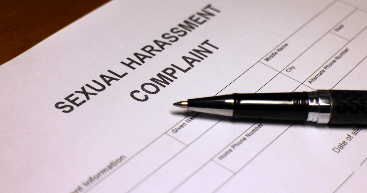 Sexual harassment document on a table.