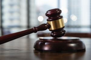 stock image of a gavel resting on the judges bench