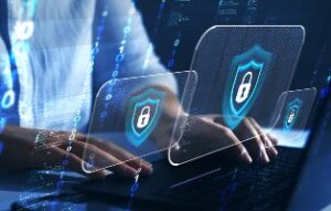 typing on computer with data breach icon